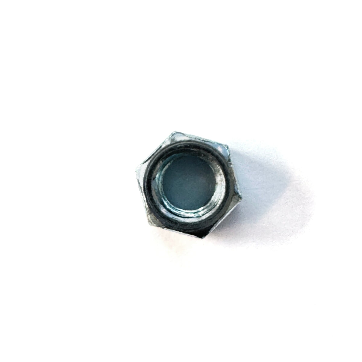 Top view of 3/8"-16 zinc finished hex nut showing internal threads